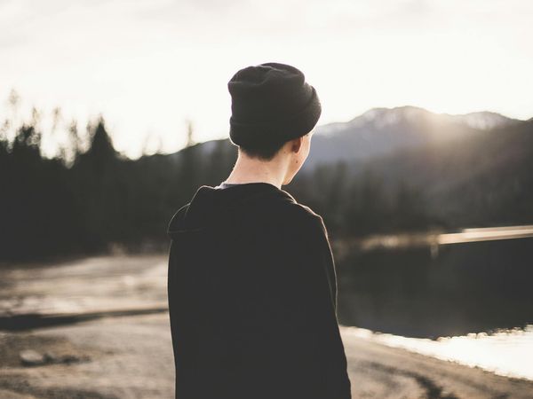 Serene natural landscape with calm water reflecting the sky, symbolizing peace of mind.